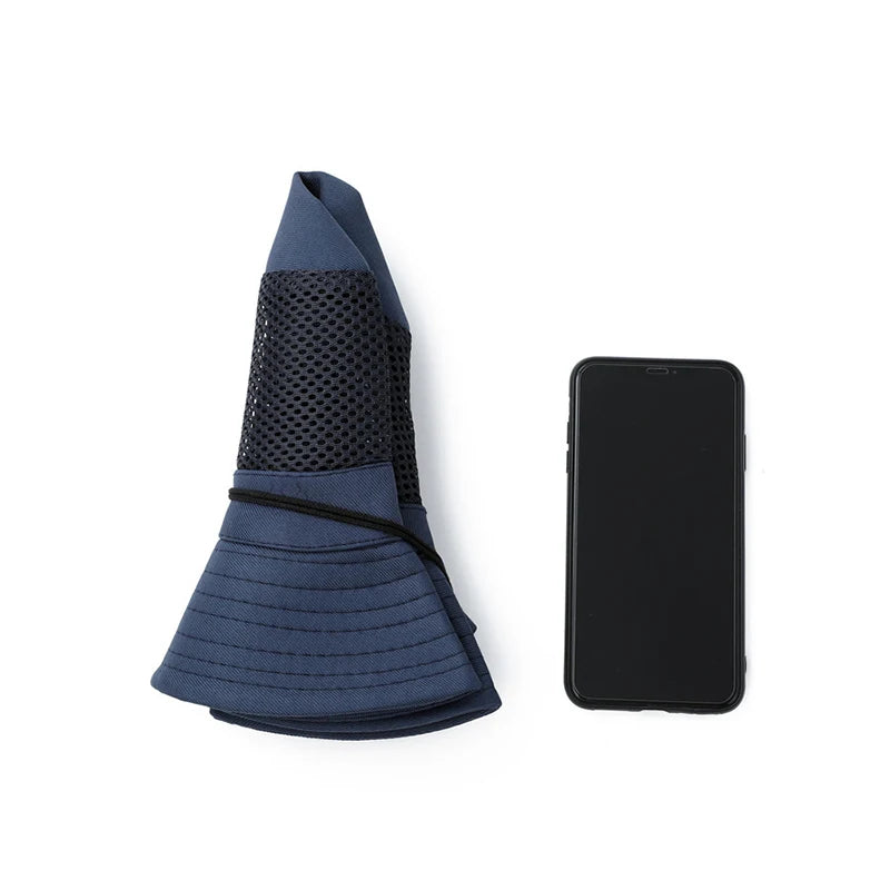Booney Hat Wide Brim Sun Protection - folded flat next to a phone
